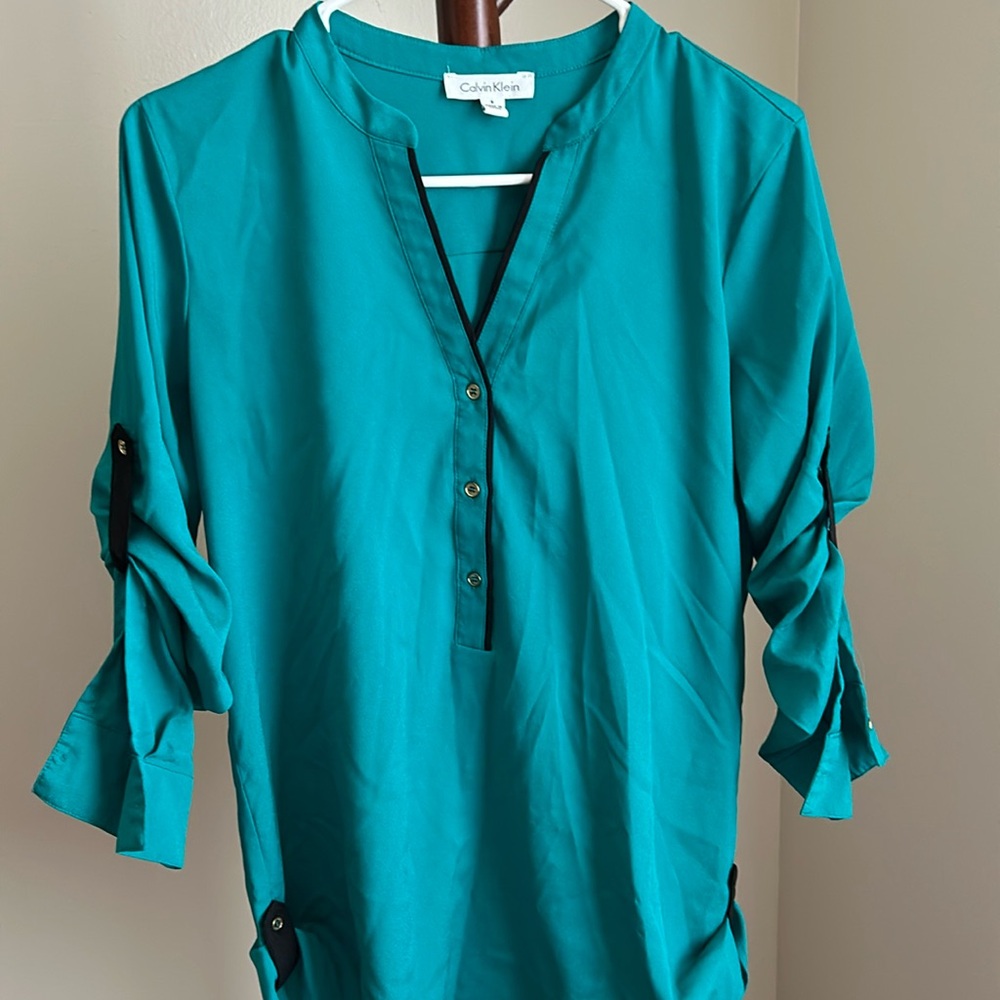 Green with black and gold accent tunic top